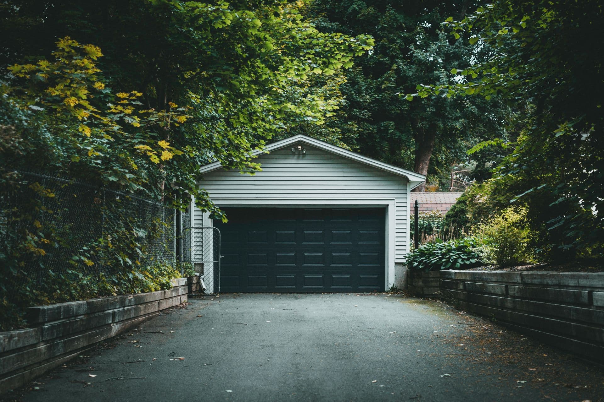 Freshly paved black asphalt driveway at a residential home